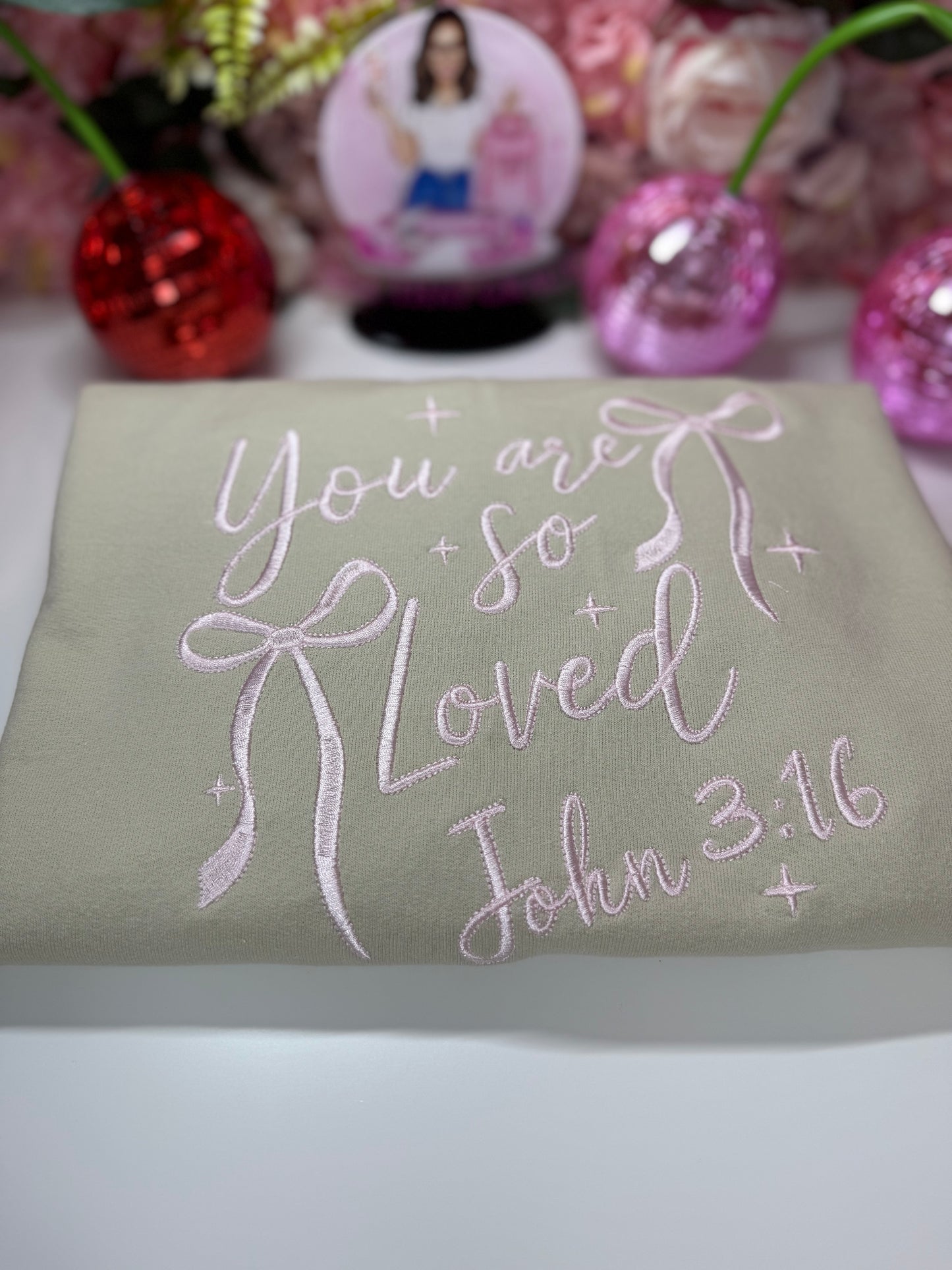 You Are So Loved John 3:16 Cream Bow Embroidered Crewneck In Light Pink Stitching