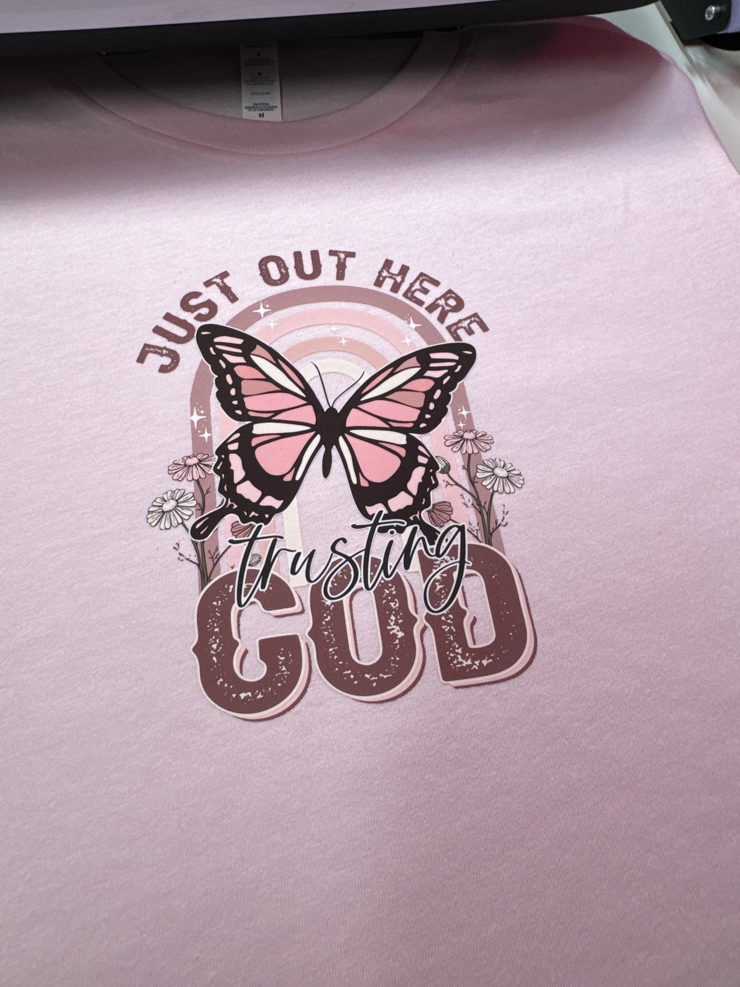 Just Out Here Trusting God Butterfly Tee In Pink Unisex Size